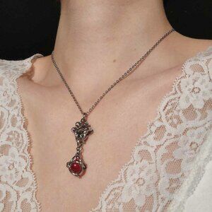 Antique style red pearl diamond-shaped pendant on a small silver chain necklace